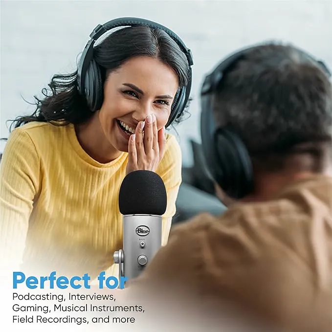 Woman podcasting with foam cover windscreen for Blue Yeti Logitech microphone during interview session